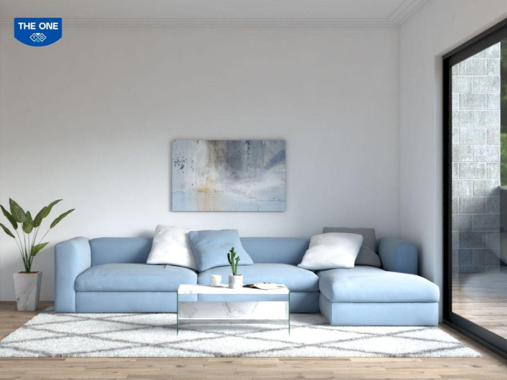 Không gian phòng khách sử dụng tông màu xanh biển và trắng (hành Kim) để tương sinh cho mệnh Đại Hải Thủy.